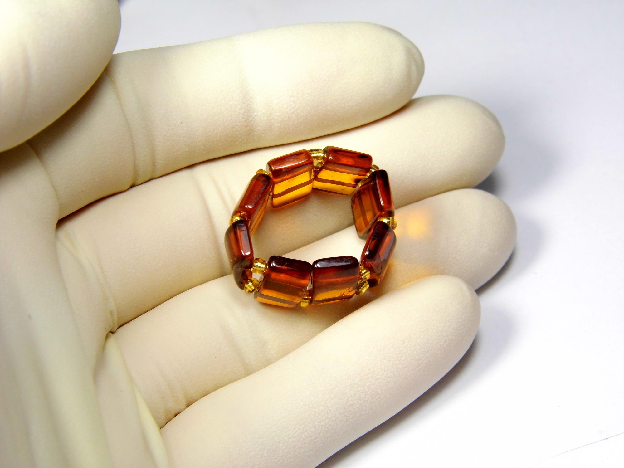Gintarinis žiedas ant gumytės. Dydis 17.5mm. Žiedas su gintaru. Rudo skaidraus konjako gintaro žiedas. Natūralus Baltijos gintaras. 0412